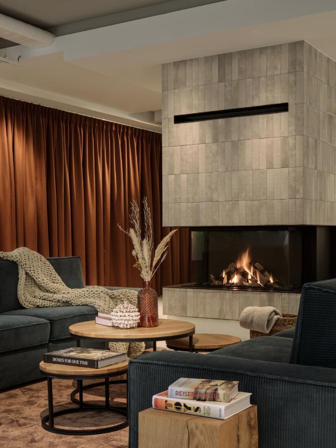 The Breeze Aparthotel Heringsdorf  Bagian luar foto A fireplace